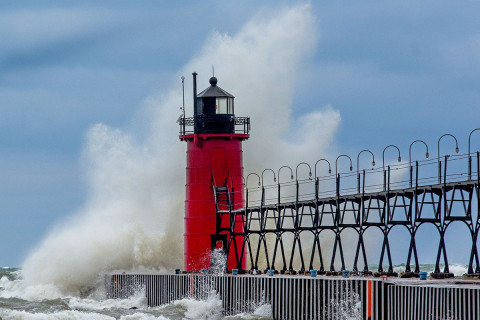 Large wave crashing into South Haven, Michigan lighthouse.