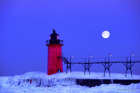 Lighthouse at South Haven Michigan during a winter moonset.